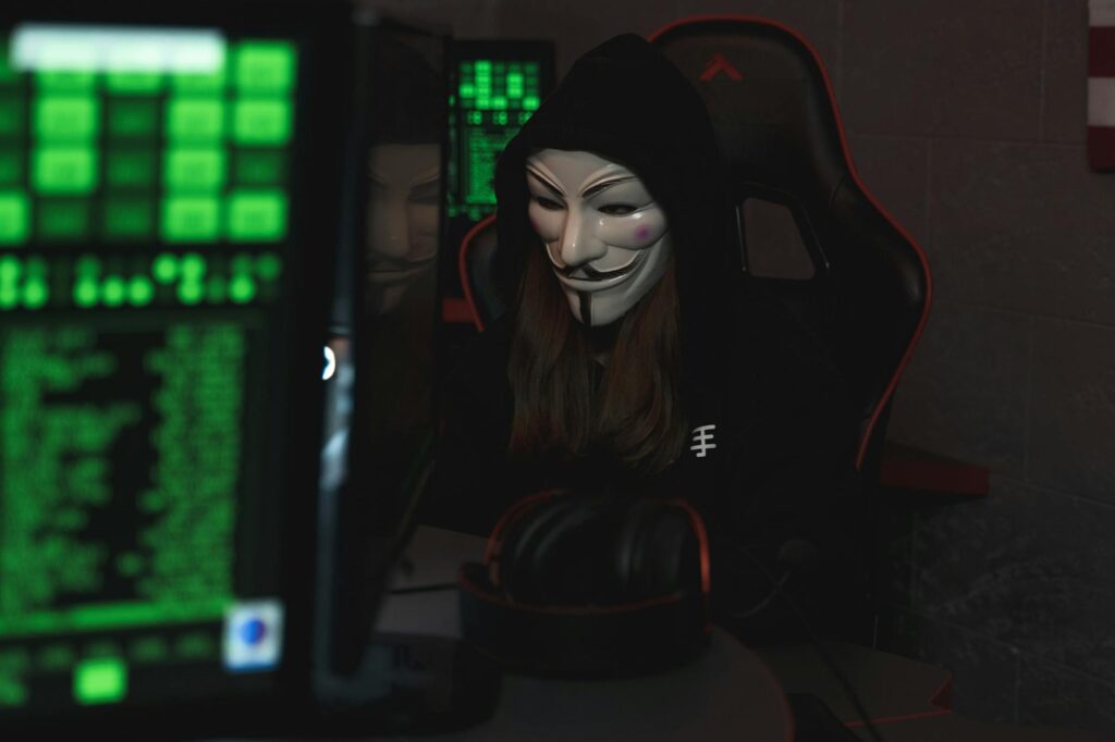anonymous hacker mask on computer screen