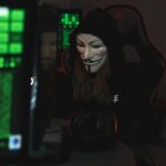 anonymous hacker mask on computer screen