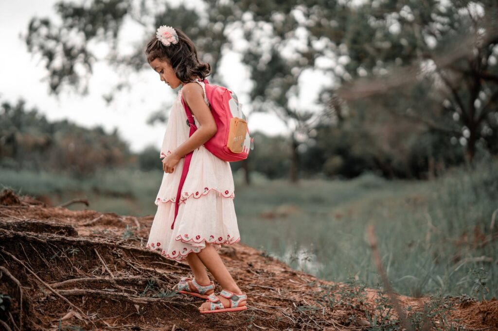 child exploring rocks nature