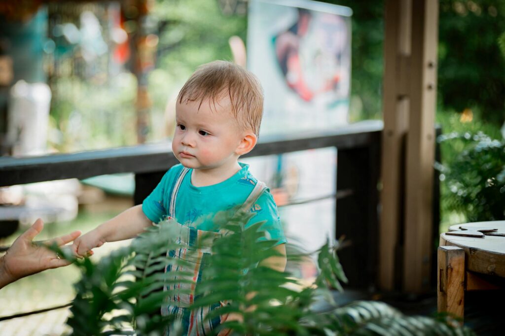child exploring rocks